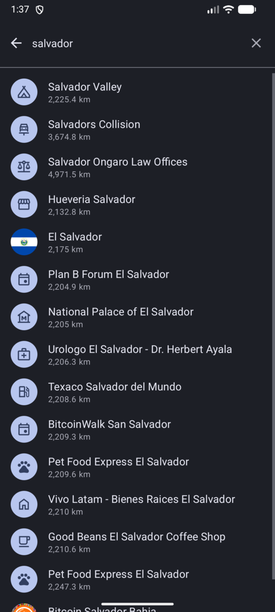Search results in dark mode, showing places, an area and events